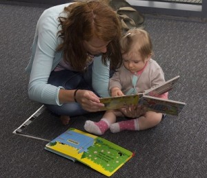 Mum reading to baby