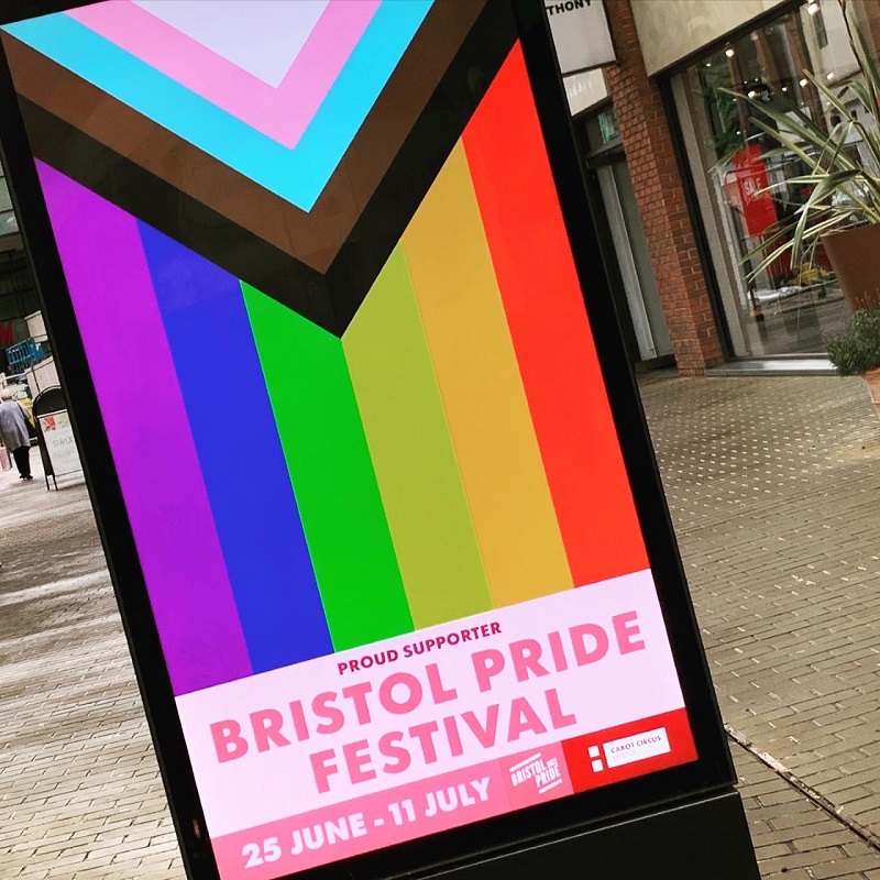 Cabot Circus displays the Pride flag with text stating 'Proud supporter Bristol Pride Festival 25 June - 11 July