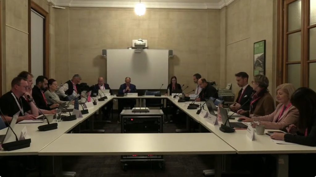 Bristol Schools Forum Safety Valve - A group of men and women dressed in professional wear sit around a table for a meeting.