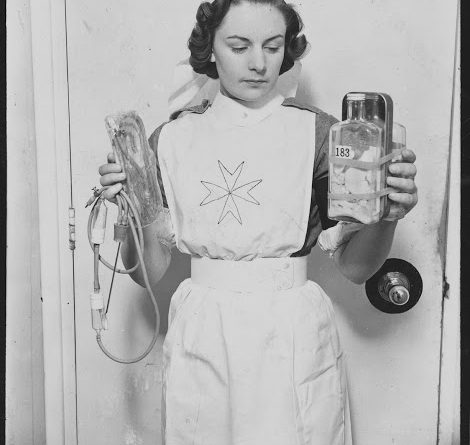 Nurse with blood transfuser